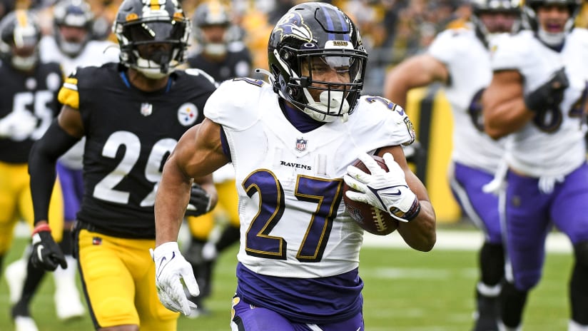 Baltimore Ravens running back J.K. Dobbins (27) runs with the ball against  the New York Giants during an NFL football game Sunday, Oct. 16, 2022, in  East Rutherford, N.J. (AP Photo/Adam Hunger