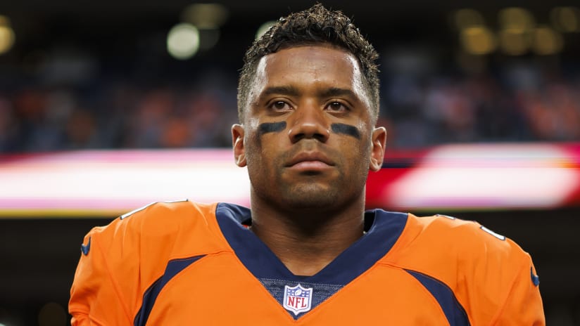 Seattle Seahawks quarterback Russell Wilson and Denver Broncos running back  Melvin Gordon exchange jerseys after an