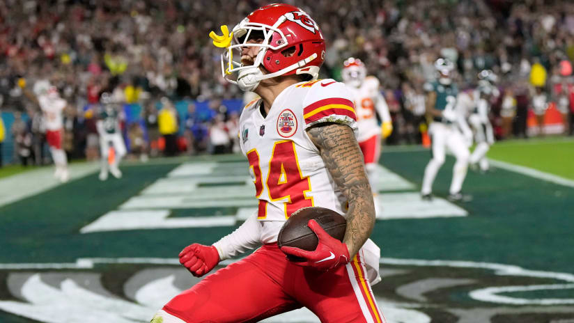 Kansas City Chiefs offensive coordinator Eric Bieniemy talks to Chiefs  tight end Travis Kelce (87) after their win over the Buffalo Bills in an  NFL divisional playoff football game, Sunday, Jan. 23