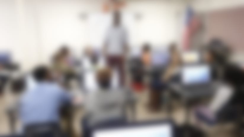 Michael Johnson stands in front of students in the computer lab named after him at Martin Middle School.