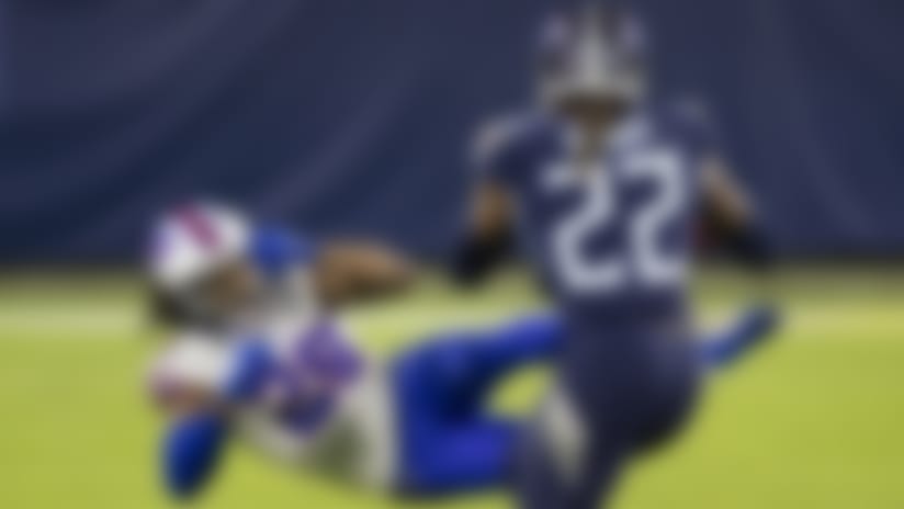 Tennessee Titans running back Derrick Henry (22) stiff arms Buffalo Bills cornerback Josh Norman (29) during the second quarter of an NFL football game, Tuesday, Oct. 13, 2020, in Nashville, Tenn. (AP Photo/Brett Carlsen)