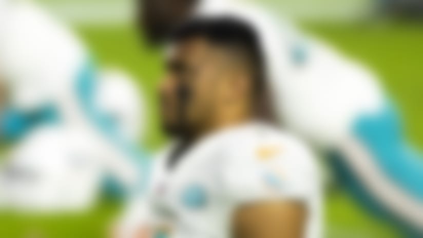 Miami Dolphins quarterback Tua Tagovailoa (1) stretches before an NFL regular season football game against the Las Vegas Raiders on Saturday, Dec. 26, 2020 in Las Vegas. The Dolphins won, 26-25. (Ric Tapia via AP)