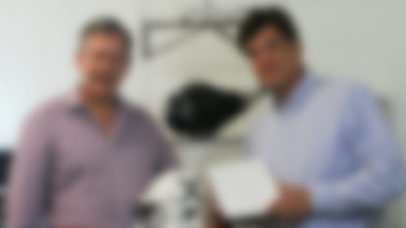 Corsair Innovations’ Sander Reynolds (left) and William Lyndon (right) display a prototype football helmet and their unique helmet liner, “Fiber Energy Absorbing Material,” or FEAM. Photo courtesy of Corsair Innovations.