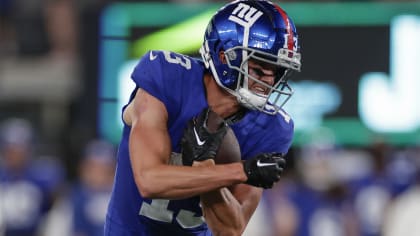 New York Giants quarterback Tommy DeVito (5) avoids Detroit Lions