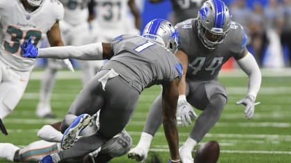 Malcolm Rodriguez and Jack Campbell of the Detroit Lions tackle