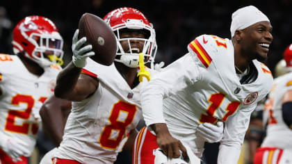 Kansas City Chiefs wide receiver Justyn Ross shoves defensive back away on  14-yard catch and run