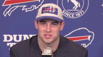 Buffalo Bills tight end Dalton Kincaid reacts to quarterback Josh Allen  reaching out to him after being drafted by Bills