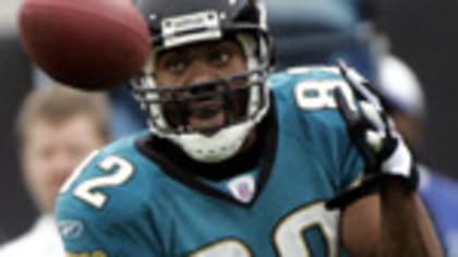 Tony Brackens of the Jacksonville Jaguars stands on the field