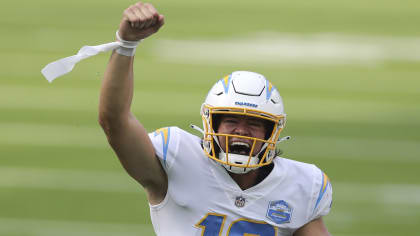 Los Angeles Chargers wide receiver Tyron Johnson (83) is defended