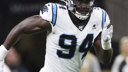 Cam Newton of the Carolina Panthers is sacked by Efe Obada of the