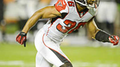 Roddy White of the Atlanta Falcons gets past Dashon Goldson of the