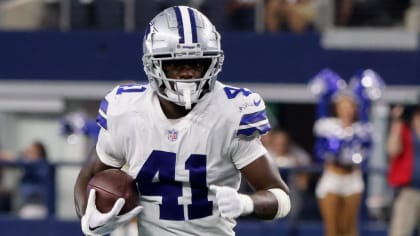 Dallas Cowboys cornerback Nahshon Wright, left, intercepts a pass