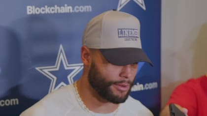 Dallas Cowboys quarterback Dak Prescott wears a Crucial Catch hat