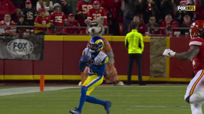 Los Angeles Rams quarterback Bryce Perkins (16), top, leaps over Los  Angeles Chargers defensive back Kemon