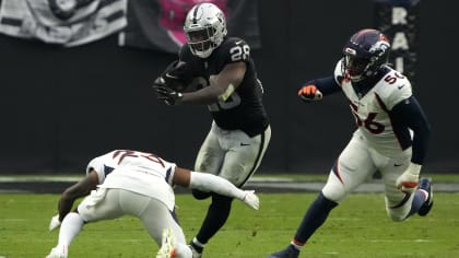 Las Vegas Raiders safety Duron Harmon jars the football loose from  Jacksonville Jaguars wide receiver Marvin Hall for key takeaway