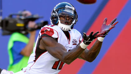 New England Patriots Brandon Meriweather reaches for the football as he  warms up for an NFL