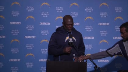 Los Angeles Chargers head coach Anthony Lynn, center, reacts on the  sideline after a replay is shown on a stadium video monitor during the  second half of an NFL football game against