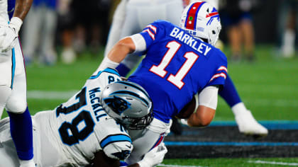 Carolina Panthers defensive tackle Marquan McCall (left) exchanges