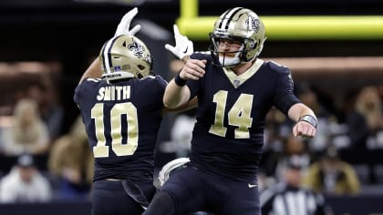 New Orleans Saints tight end Adam Trautman (82) runs the ball up the field  during an NFL football game against the Minnesota Vikings at Tottenham  Hotspur Stadium, Sunday, Oct. 2, 2022, in