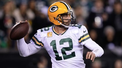 Green Bay Packers quarterback Aaron Rodgers (12) looks to pass the ball  against the Chicago Bears during the first half of an NFL football game,  Sunday, Dec. 4, 2022, in Chicago. (AP