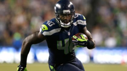 Coleman signs for Seahawks fans in U Book Store appearance