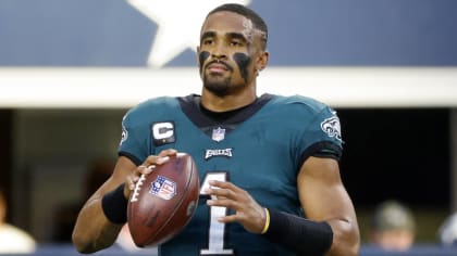 Philadelphia Eagles offensive players huddle up in a group as quarterback  Jalen Hurts (1) calls a play in the huddle during an NFL football game  against the Dallas Cowboys, Monday, Sept. 27