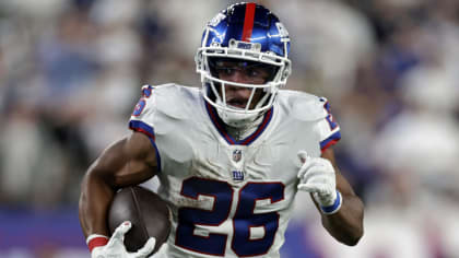 New York Giants' Saquon Barkley (26) warms up at the team's NFL football  training facility Wedn …