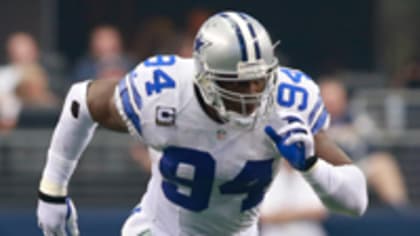 Dallas Cowboys defensive end DeMarcus Ware, left, works with