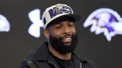 Los Angeles Rams wide receiver Odell Beckham Jr. (3) is greeted by  Baltimore Ravens head coach John Harbaugh before an NFL football game,  Sunday, Jan. 2, 2022, in Baltimore. (AP Photo/Terrance Williams