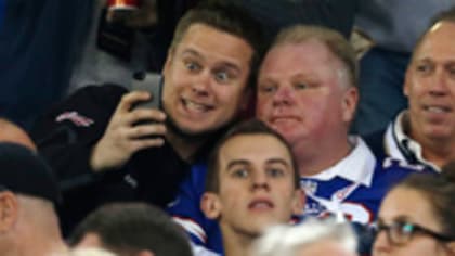 Rob Ford eats chicken wings, steals a seat and works up the crowd the Buffalo  Bills game in Toronto