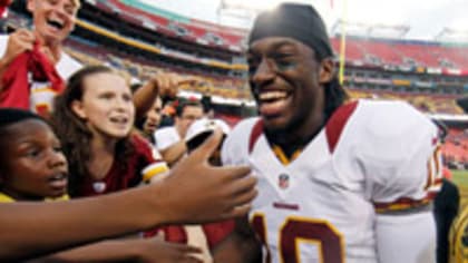 A Redskin Fan Looks At A Robert Griffin III Jersey In The Hall Of Fame Store