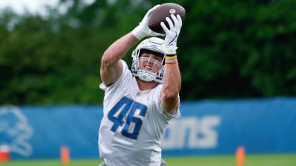 Malcolm Rodriguez and Jack Campbell of the Detroit Lions tackle