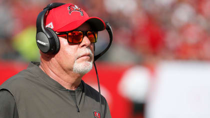 Bruce Arians looks like many things with face shield, headset and hat