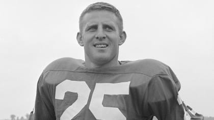 Tommy McDonald, All-America Oklahoma back, poses with a new number, head  gear and ball after he signed with the Philadelphia Eagles, Jan. 14, 1957,  to start a professional career in the NFL.