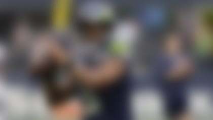 Seattle Seahawks quarterback Russell Wilson passes during warmups before an NFL preseason football game against the Denver Broncos, Saturday, Aug. 21, 2021, in Seattle. (AP Photo/Stephen Brashear)