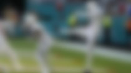 Miami Dolphins punter Thomas Morstead (4) sees the ball go backwards after attempting a punt during the second half of an NFL football game against the Buffalo Bills, Sunday, Sept. 25, 2022, in Miami Gardens, Fla. The play resulted in a safety for the Buffalo Bills. (AP Photo/Rebecca Blackwell)