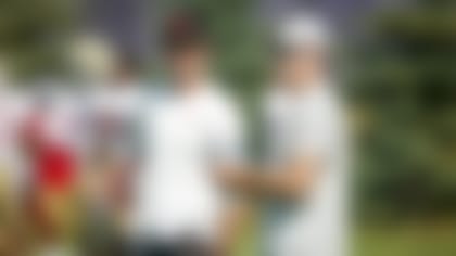 San Francisco 49ers head coach Kyle Shanahan, left, and general manager John Lynch watch their team take part in joint drills with the Minnesota Vikings at the Vikings NFL football team's practice facility in Eagan, Minn., Wednesday, Aug. 17, 2022. (AP Photo/Bruce Kluckhohn)