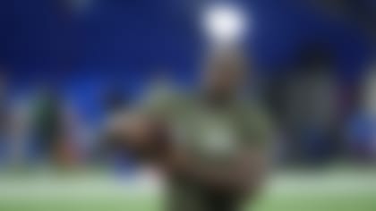Northwestern defensive lineman Adetomiwa Adebawore runs a drill at the NFL football scouting combine in Indianapolis, Thursday, March 2, 2023. (AP Photo/Michael Conroy)