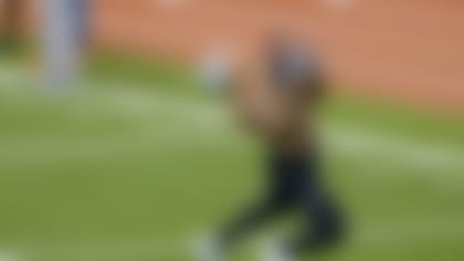 Bailey hauls in the ball at Marshall's pro day, which was his first public workout in his NFL comeback plan.