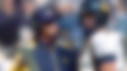 California head coach Jeff Tedford confers with quarterback Aaron Rodgers during a break in the action in the first quarter of a non-conference game against Air Force in Falcon Stadium at Air Force Academy, Colo., on Saturday, Sept.. 4, 2004. (AP Photo/David Zalubowski)