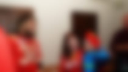 Chiefs players and representatives from KC Southern make a surprise visit to a local family at the Guadalupe Center.