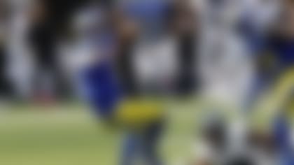 Los Angeles Rams quarterback Matthew Stafford, left, goes down after being tackled by Philadelphia Eagles defensive tackle Jalen Carter, center, during the first half of an NFL football game Sunday, Oct. 8, 2023, in Inglewood, Calif. (AP Photo/Kevork Djansezian)