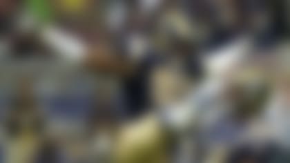 St. Louis Rams' Anthony Hargrove (95) celebrates with Fakhir Brown after sacking Denver Broncos quarterback Jake Plummer in the first half in an NFL football game Sunday, Sept. 10, 2006, in St. Louis. The Rams won 18-10. (AP Photo/Bill Boyce)