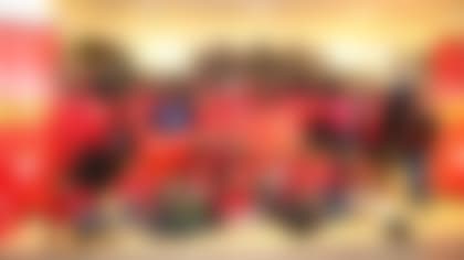 Kansas City Chiefs tight end Travis Kelce (87) poses for a picture with children from a local YMCA during a shopping spree at JcPenney, Tuesday, December 6, 2016, in Independence, Missouri.