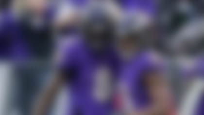 Baltimore Ravens quarterback Lamar Jackson (8) and wide receiver Devin Duvernay (13) celebrate after connecting for a touchdown during the second half of an NFL football game against the Minnesota Vikings, Sunday, Nov. 7, 2021, in Baltimore. (AP Photo/Nick Wass)