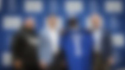 New York Giants first round draft pick Deonte Banks holds up a Giants jersey with head coach Brian Daboll, left, general manager Joe Schoen and president, CEO and co-owner John Mara, right, during a press conference at the NFL football team's training center in East Rutherford, N.J., Friday, April 28, 2023. (AP Photo/Stefan Jeremiah)