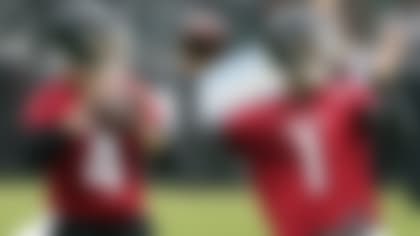 Atlanta Falcons quarterbacks Marcus Mariota (1) and Desmond Ridder (4) work during their NFL minicamp football practice, Tuesday, June 14, 2022, in Flowery Branch, Ga. (AP Photo/John Bazemore)