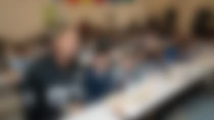 Las Vegas Raiders tight end Darren Waller (83) poses for a photo while serving and sharing nutritious meals with first and second grade students at Jack Dailey Elementary.