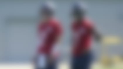 Seattle Seahawks quarterback Drew Lock, left, stands with quarterback Geno Smith, right, during NFL football practice Thursday, July 28, 2022, in Renton, Wash. (AP Photo/Ted S. Warren)