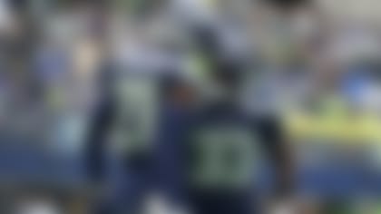 Seattle Seahawks cornerback Devon Witherspoon (21) reacts with safety Jamal Adams (33) after they helped break up a pass in the end zone against the Arizona Cardinals during the first half of an NFL football game, Sunday, Oct. 22, 2023, in Seattle. The Seahawks won 20-10. (AP Photo/Lindsey Wasson)